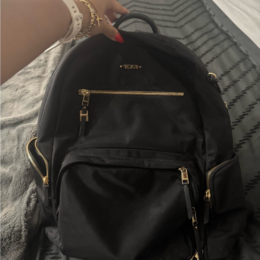 Tumi Black Backpack with Gold Hardware